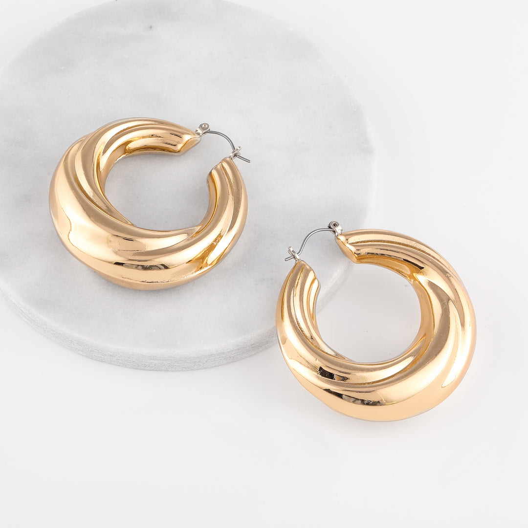 Round Twisted Hoop Earrings | Earrings by DORADO