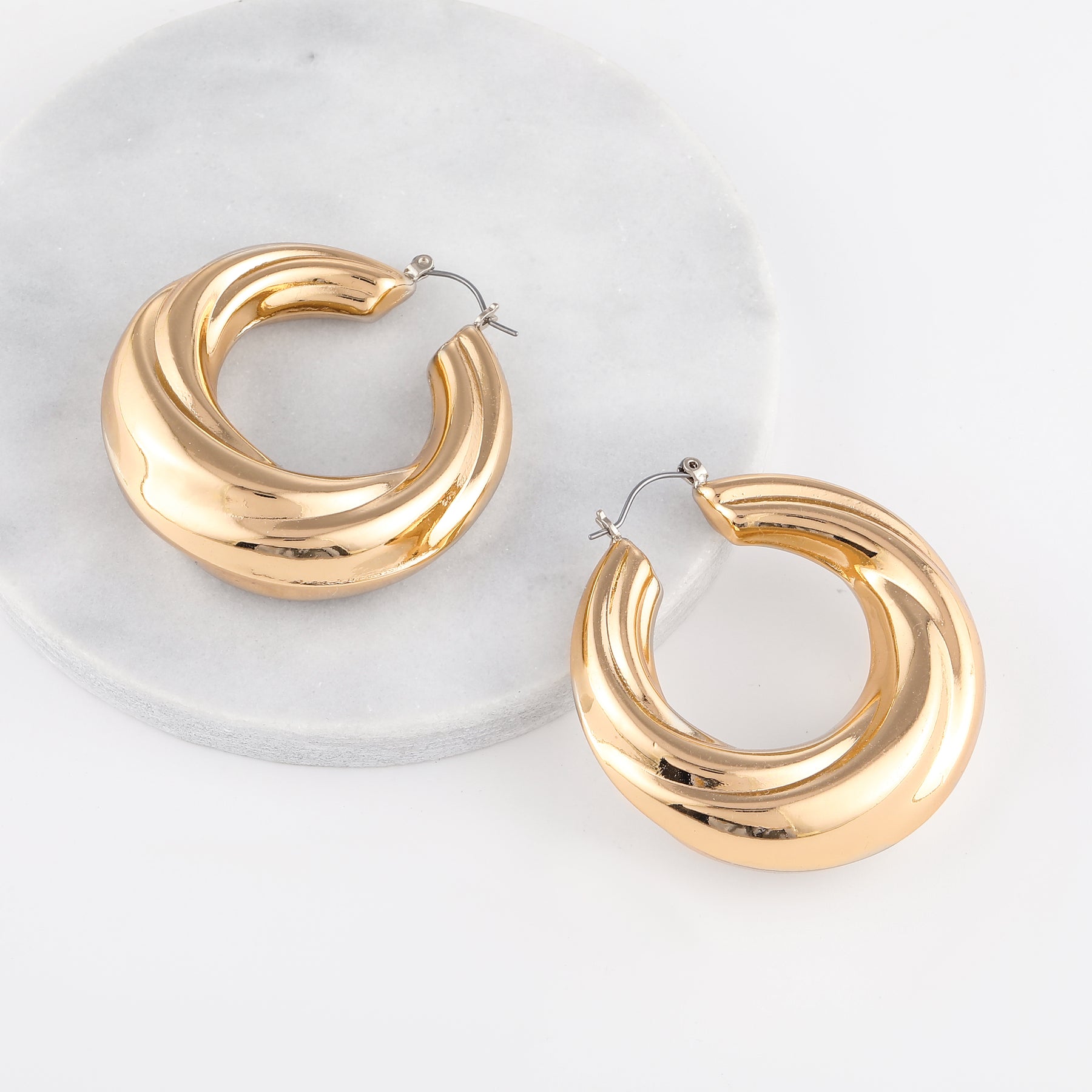 Round Twisted Hoop Earrings | Earrings by DORADO