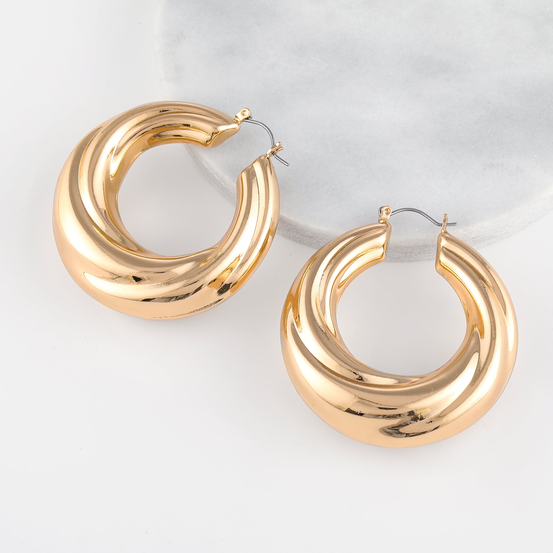 Round Twisted Hoop Earrings | Earrings by DORADO