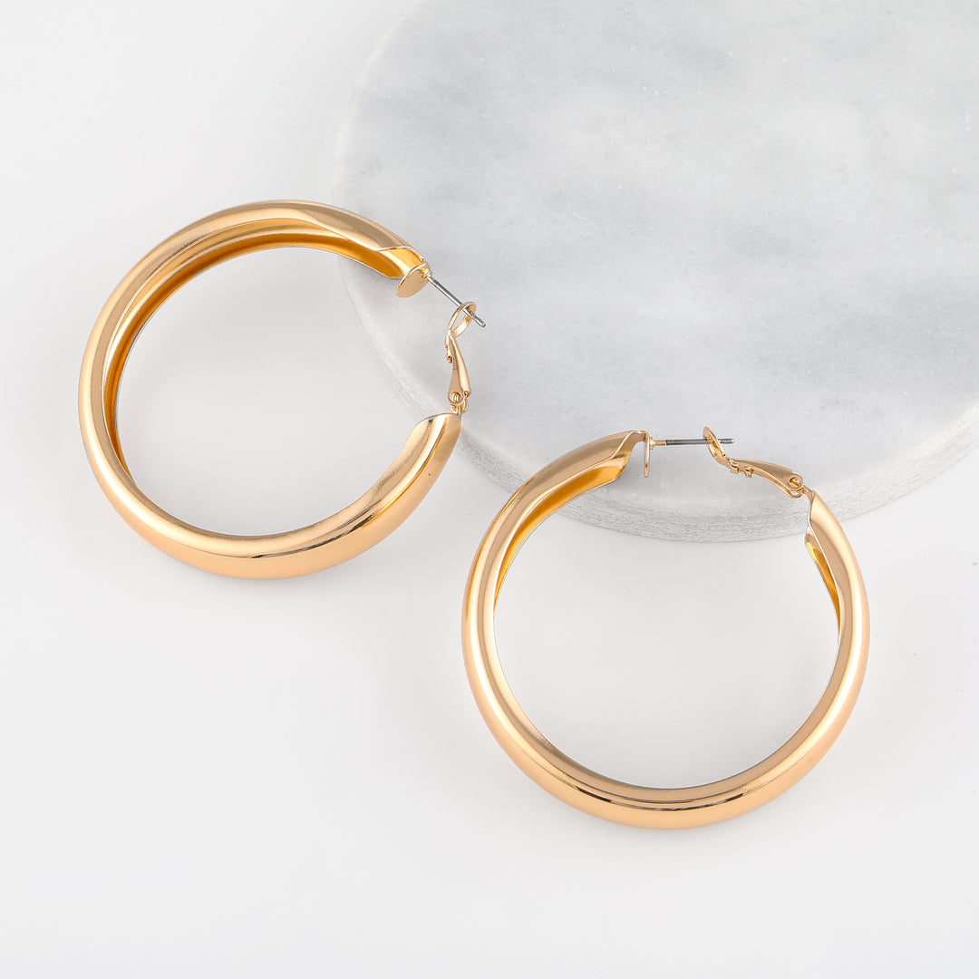Chunky Hollow Hoop Earrings | Earrings by DORADO