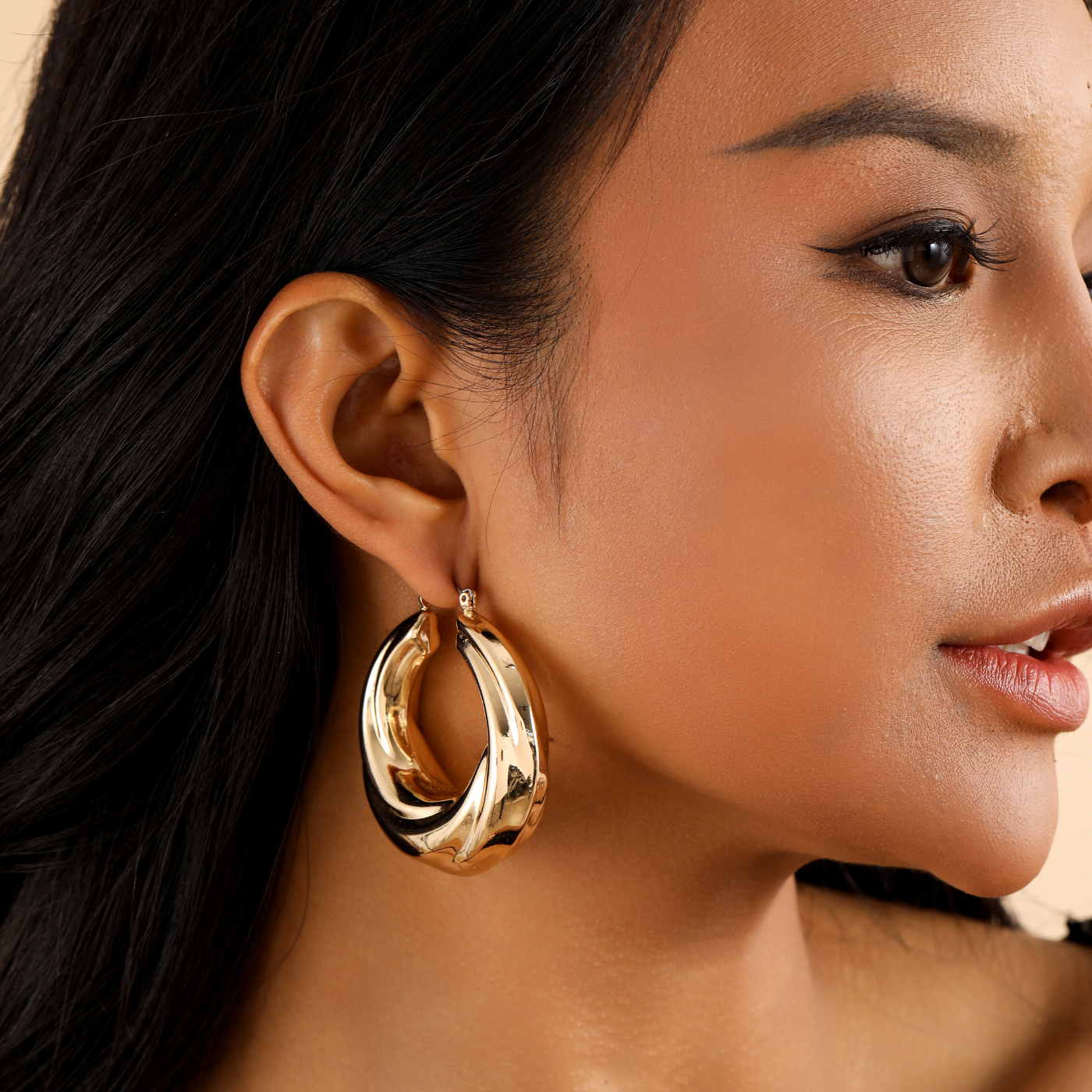 Round Twisted Hoop Earrings | Earrings by DORADO